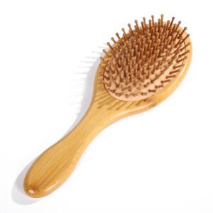 Bamboo hair brush with air cushion comb design and bamboo bristles, suitable for scalp massage and dry hair care.