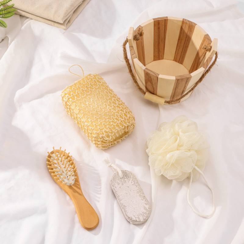 Bamboo bath set with wooden tub, bath tools, sponge, pumice stone, and brush made from non toxic body care materials.