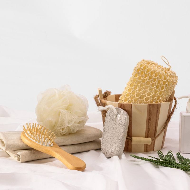 Bamboo bath set with wooden tub, bath tools, sponge, pumice stone, and brush made from non toxic body care materials.