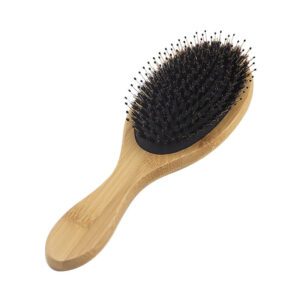 Bamboo hair brush with boar bristles and cushioned base, designed for scalp massage and daily hair care use.