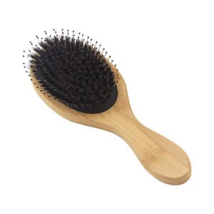 Bamboo hair brush with boar bristles and cushioned base, designed for scalp massage and daily hair care use.