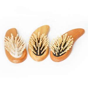 Bamboo bristle massage comb by JEYGO, designed for curly hair, featuring a rubber airbag cushion.