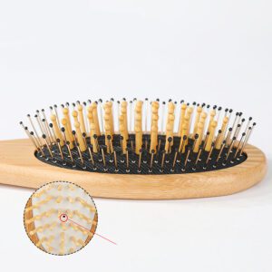 Bamboo paddle hair brush with rubber cushion and wooden handle for gentle scalp massage.