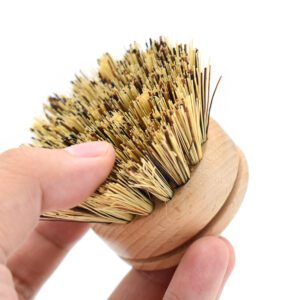 Round bamboo dish brush replacement head with sisal and palm fiber bristles on a white background