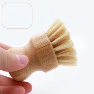 Bamboo dish brush with silicone bristles and ergonomic handle, perfect for cleaning dishes and kitchenware.