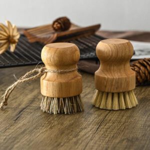 Bamboo dish brush with silicone bristles and ergonomic handle, perfect for cleaning dishes and kitchenware.
