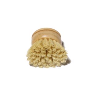 Round bamboo dish brush head with natural sisal bristles photographed on a clean white background