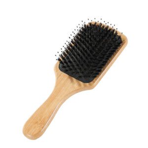 Bamboo comb with air cushion base and mixed bristles, designed as a head massage tool for daily hair care.