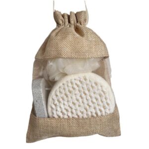 Bath body gift set in a linen tote bag with natural loofah sponges, scrubbing stone for feet, and bath ball.