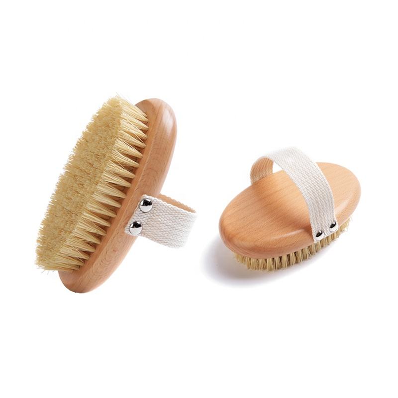 A body brush made of beech wood with boar bristles and a cotton strap, designed for skin exfoliation and dry brushing.