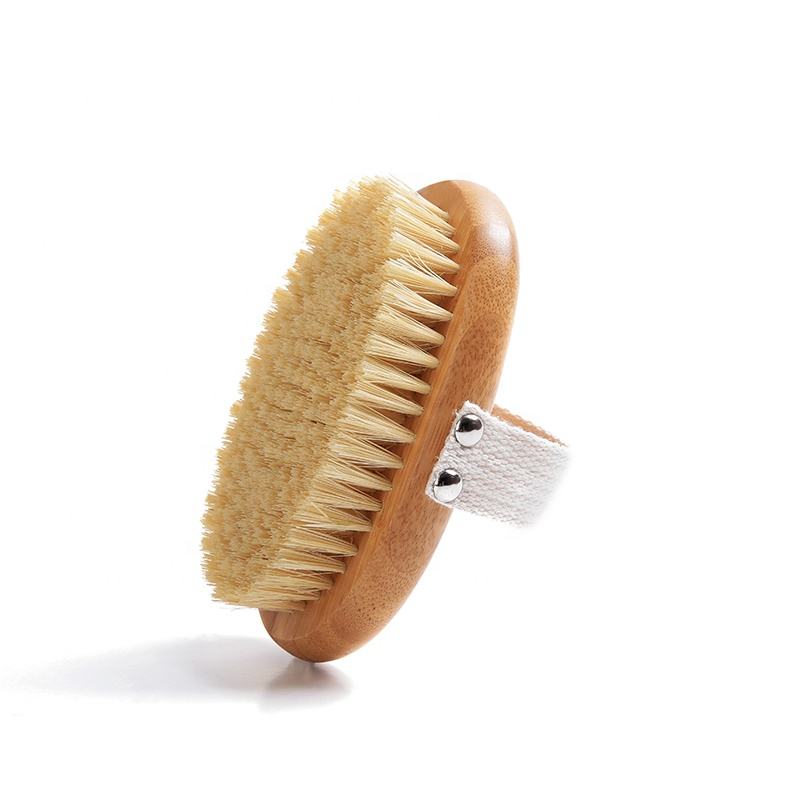 A body brush made of beech wood with boar bristles and a cotton strap, designed for skin exfoliation and dry brushing.