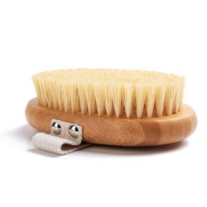 A body brush made of beech wood with boar bristles and a cotton strap, designed for skin exfoliation and dry brushing.