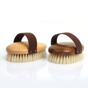 A high-quality boar bristle brush with a wooden handle, designed for effective exfoliation and skin rejuvenation.