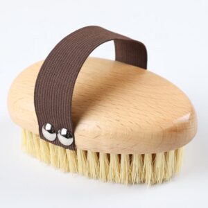 A high-quality boar bristle brush with a wooden handle, designed for effective exfoliation and skin rejuvenation.