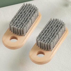 JEYGO handheld laundry brush with wooden handle and durable plastic bristles for effective clothes cleaning.