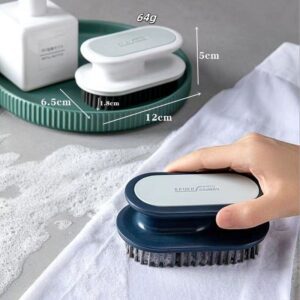 JEYGO clothing cleaning brush with ergonomic plastic handle, designed for easy stain removal during laundry care.