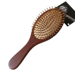 Wooden hair growth comb with rounded massage pins, designed to stimulate the scalp and support healthy brushing routines.