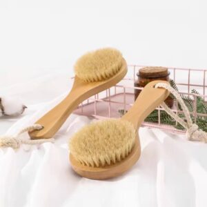 A wooden shower back brush with natural boar bristles, designed for dry brushing before or after your shower.