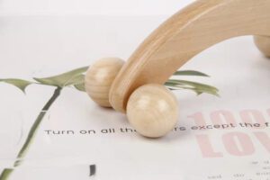 JEYGO wooden massage roller with curved handle and dual rolling heads for body massage therapy.