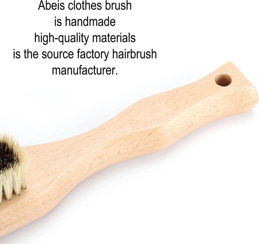 JEYGO clothes brush with wooden handle and mixed bristles, designed for gentle and effective clothing cleaning.