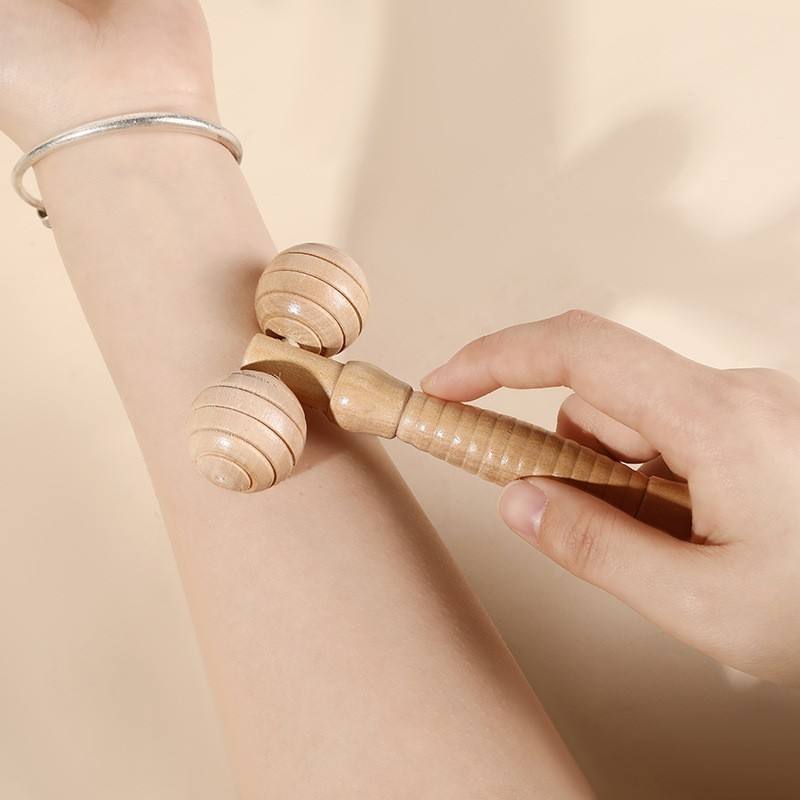 JEYGO wooden facial roller massager with dual rolling heads for targeted massage and relaxation.
