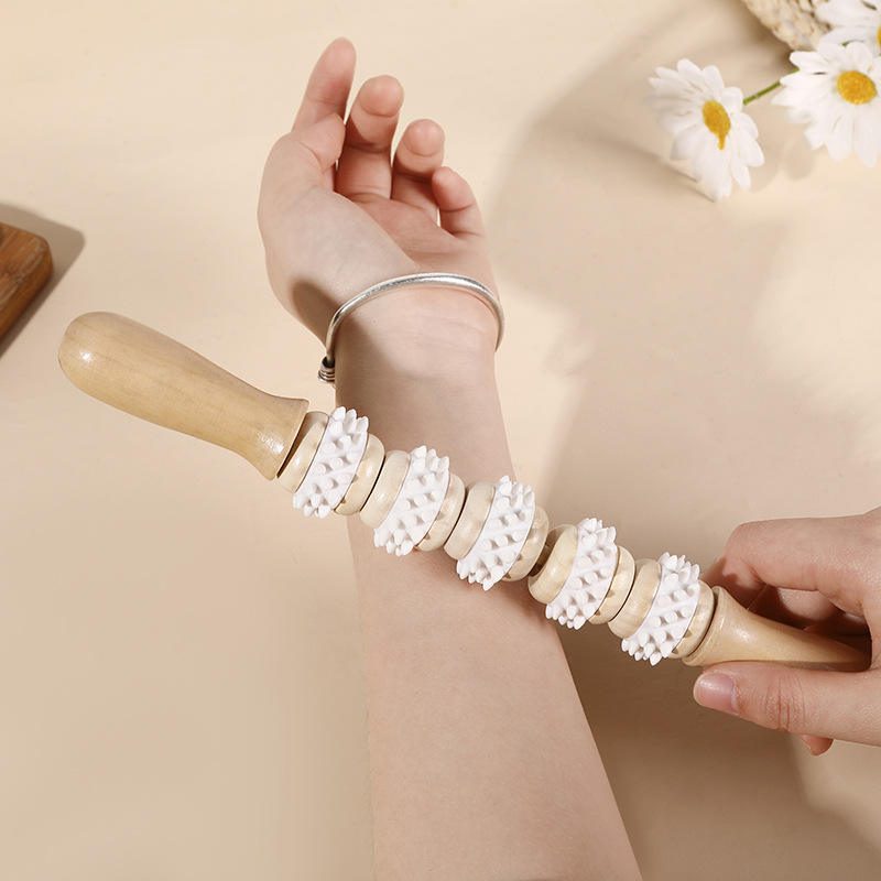 JEYGO wooden massage roller stick with rotating textured wheels, designed for muscle relaxation and daily body massage use.