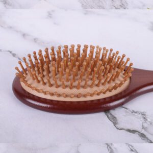 Large wooden paddle massage comb with rounded pins, designed for scalp stimulation and smooth daily hair brushing.
