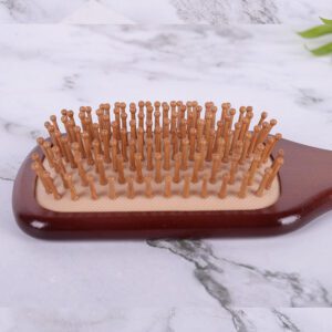 Large wooden paddle massage comb with rounded pins, designed for scalp stimulation and smooth daily hair brushing.