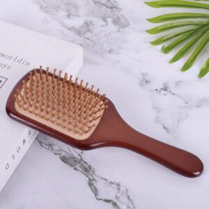 Large wooden paddle massage comb with rounded pins, designed for scalp stimulation and smooth daily hair brushing.