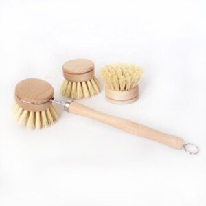 Long-handle wooden dishwashing brush with light bamboo handle, stainless steel neck, and round sisal bristle head on white background.