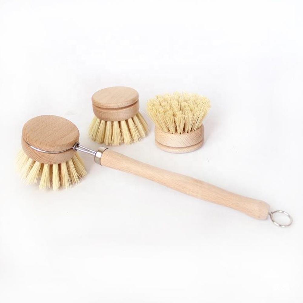 Long-handle wooden dishwashing brush with light bamboo handle, stainless steel neck, and round sisal bristle head on white background.