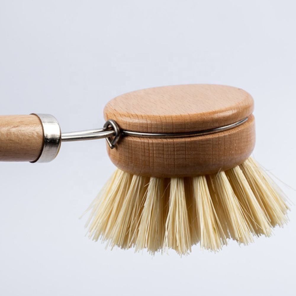 Long-handle wooden dishwashing brush with light bamboo handle, stainless steel neck, and round sisal bristle head on white background.