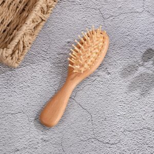 Massage comb with beech wood handle and hard rubber cushion, designed for scalp stimulation and daily grooming.