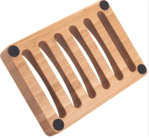 JEYGO bamboo soap dish with carved drainage slots, designed to keep soap dry and organized.