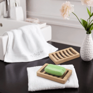 JEYGO bamboo soap dish with carved drainage slots, designed to keep soap dry and organized.