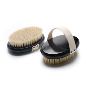A sleek bath brush with handle, designed for exfoliating dry skin and promoting smooth, healthy skin.