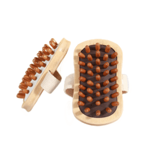 Handheld beech-wood scalp massager brush with rounded rubber massage nodes and a woven strap for comfortable grip.