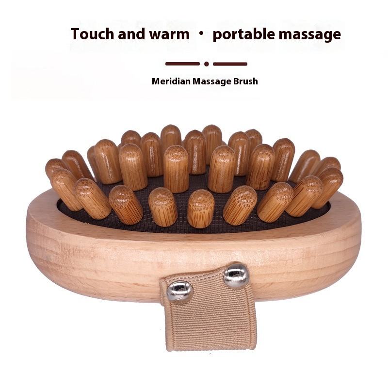 Oval-shaped wooden bath and scalp massage brush with elastic hand strap and multiple rounded massage nodes, produced by a China-based bath brush manufacturer.