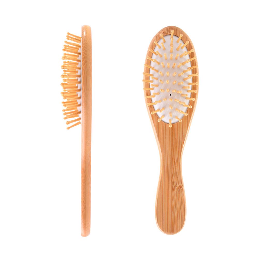 Bamboo scalp massage comb with air cushion and flexible airbag base for daily hair care.