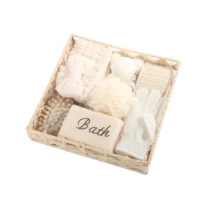 Shower gift set displayed in a woven basket with body care gift set items including bath sponge, gloves, brush, towel, and massage accessories.