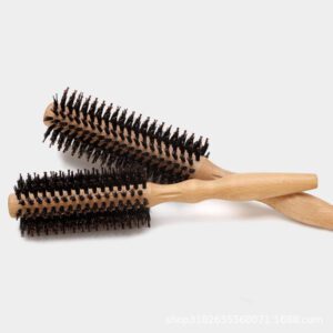 Small round hairbrush with wooden handle and mixed bristles, a wooden hairbrush designed as a round hair brush for styling.