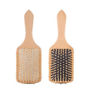 Wood comb with smooth wooden bristles designed as a scalp massage comb for comfortable daily hair care.
