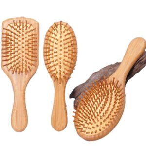 Wooden comb massage brush with beech wood handle and cushioned pins, suitable for gentle scalp brushing.