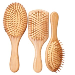 Wooden comb massage brush with beech wood handle and cushioned pins, suitable for gentle scalp brushing.