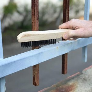 JEYGO stainless steel wire brush with wood handle, designed for durable surface cleaning and debris removal.
