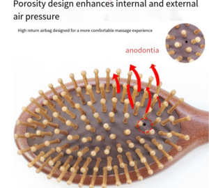 Round wooden hair brush made of sandalwood with air cushion and smooth pins for gentle scalp massage.