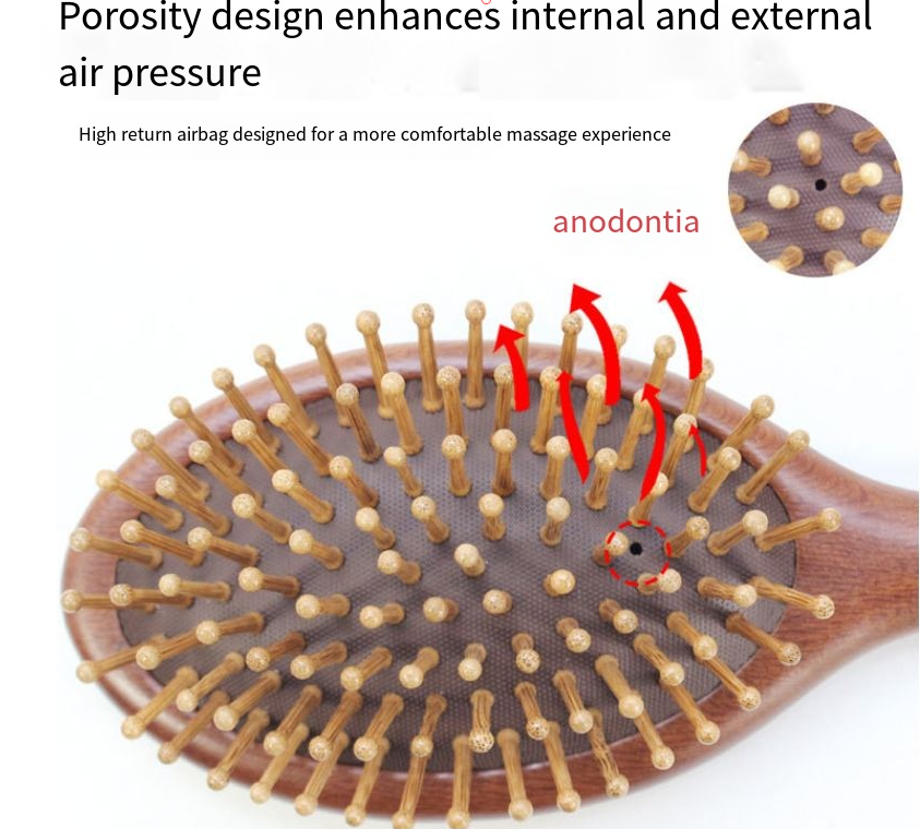 Round wooden hair brush made of sandalwood with air cushion and smooth pins for gentle scalp massage.