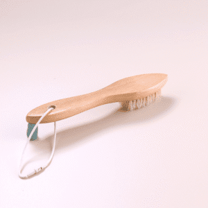 Wooden shoe brush with hanging loop and natural bristles, a shoe cleaning brush and brush for shoe maintenance.