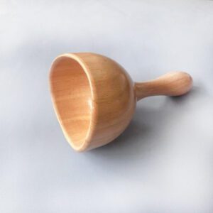 Wooden gua sha body massage cup with handle, suitable for fire cupping massage and body relaxation.