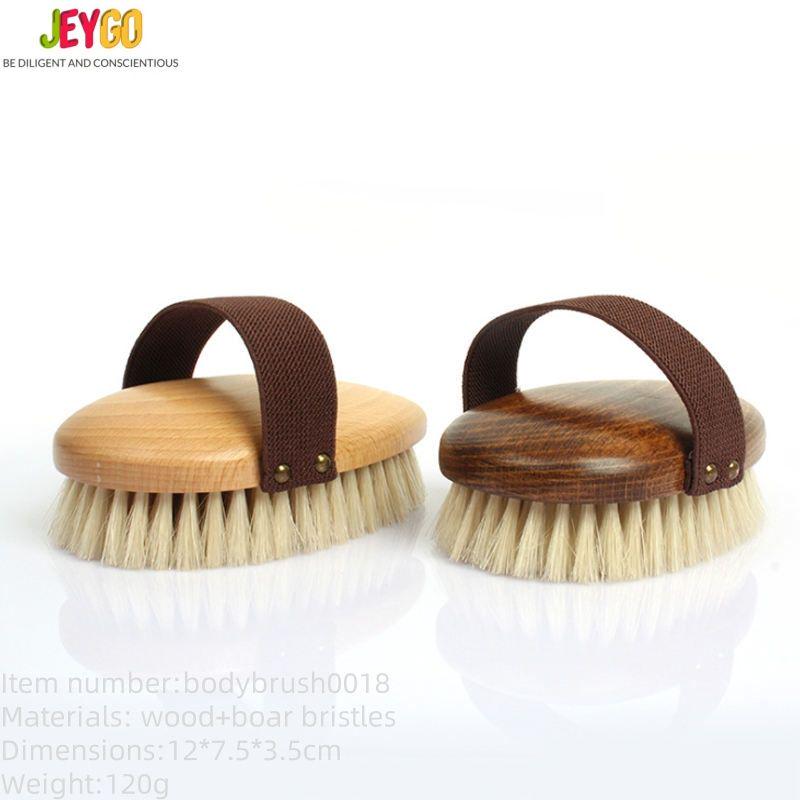 A high-quality boar bristle brush with a wooden handle, designed for effective exfoliation and skin rejuvenation.
